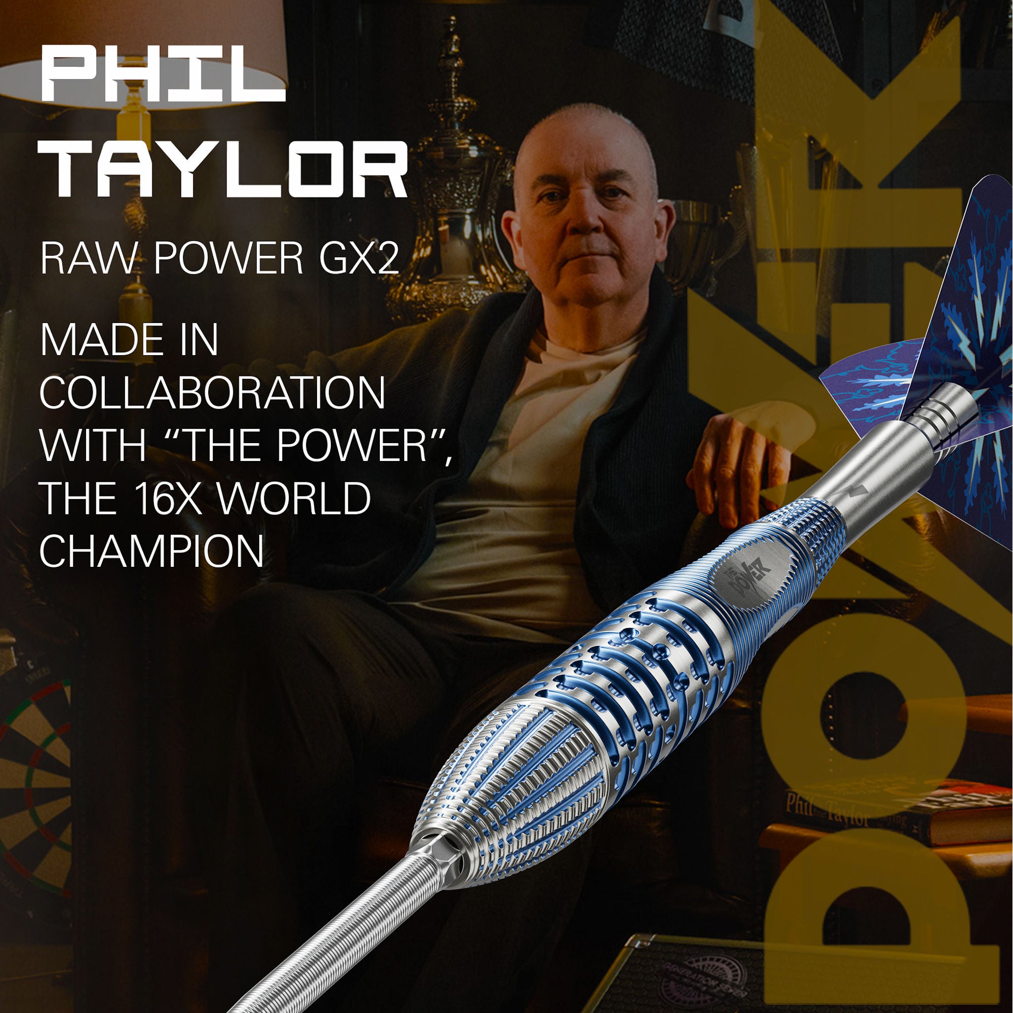 Phil Taylor with a dart labeled 'Raw Power GX2' in a promotional setting. Phil Taylor with a dart labeled 'Raw Power GX2' in a promotional setting.