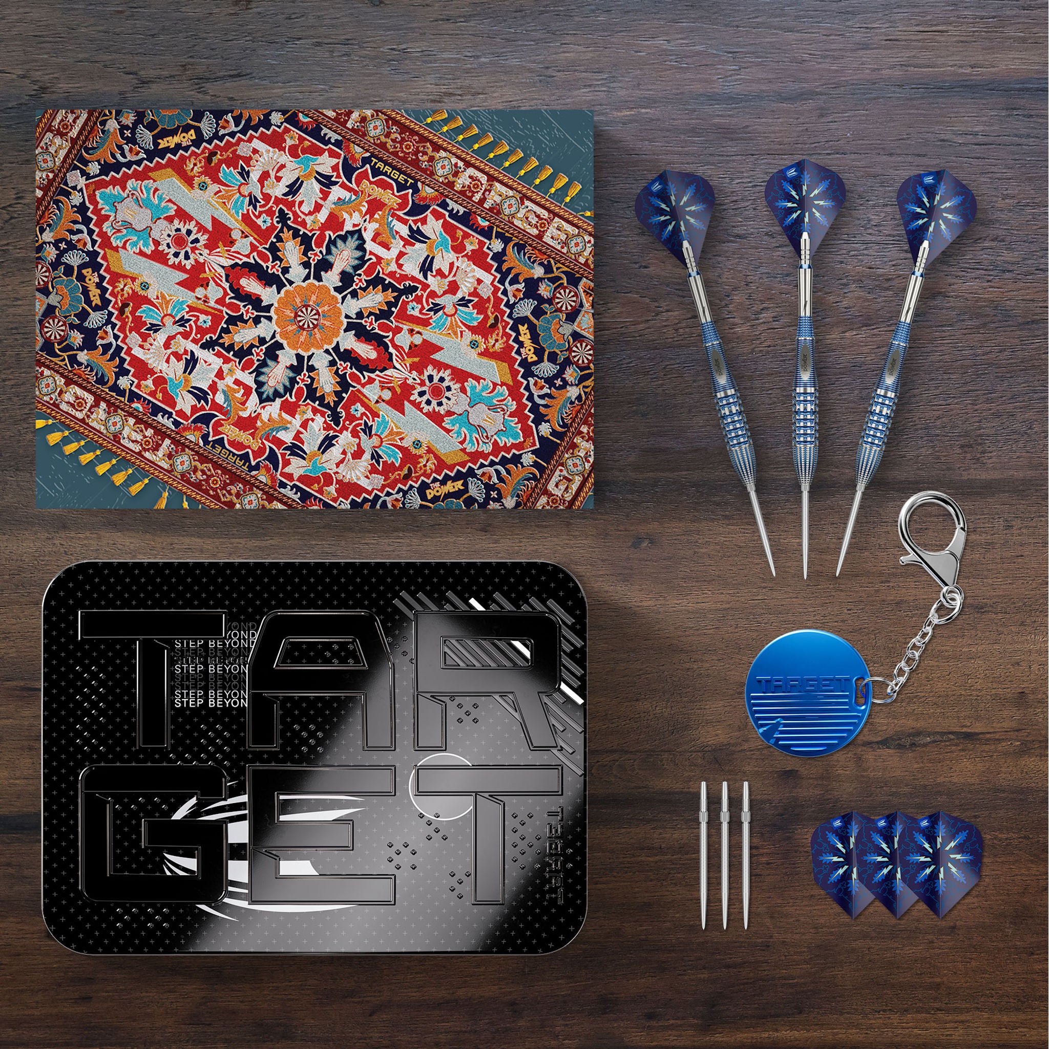 Collection of items including a dartboard, darts, and related accessories on a wooden surface. Collection of items including a dartboard, darts, and related accessories on a wooden surface.