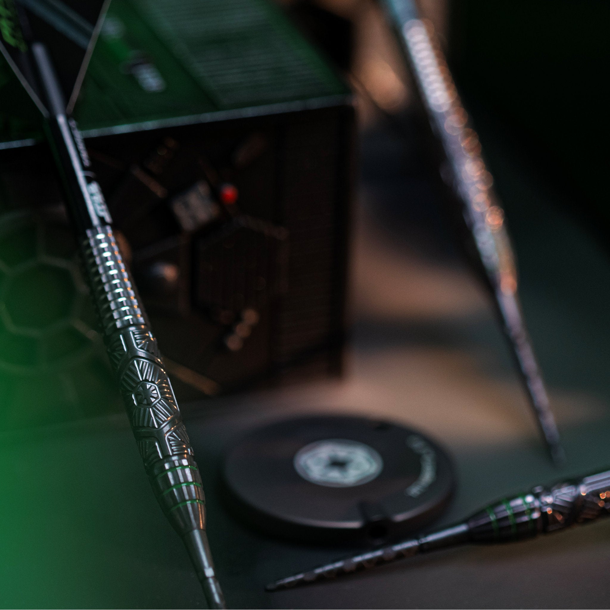 Close-up of darts on a green dartboard with a blurred background Close-up of darts on a green dartboard with a blurred background