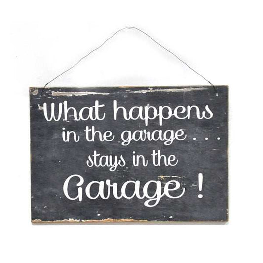 Distressed metal wall sign with "What Happens in the Garage Stays in the Garage" text and hanging wire