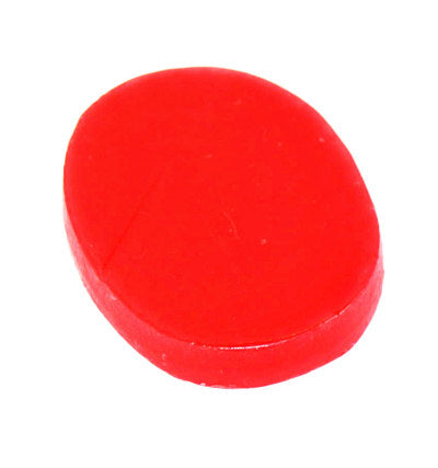Red dart finger grip wax for improved dart handling and grip enhancement.