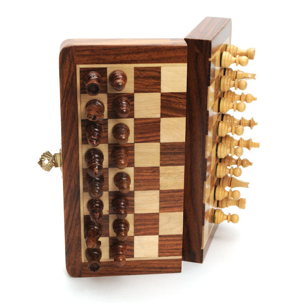 Folding 12"  Magnetic Chess Set by WE shown on its side partially folded with the magnetic chess pieces attached.