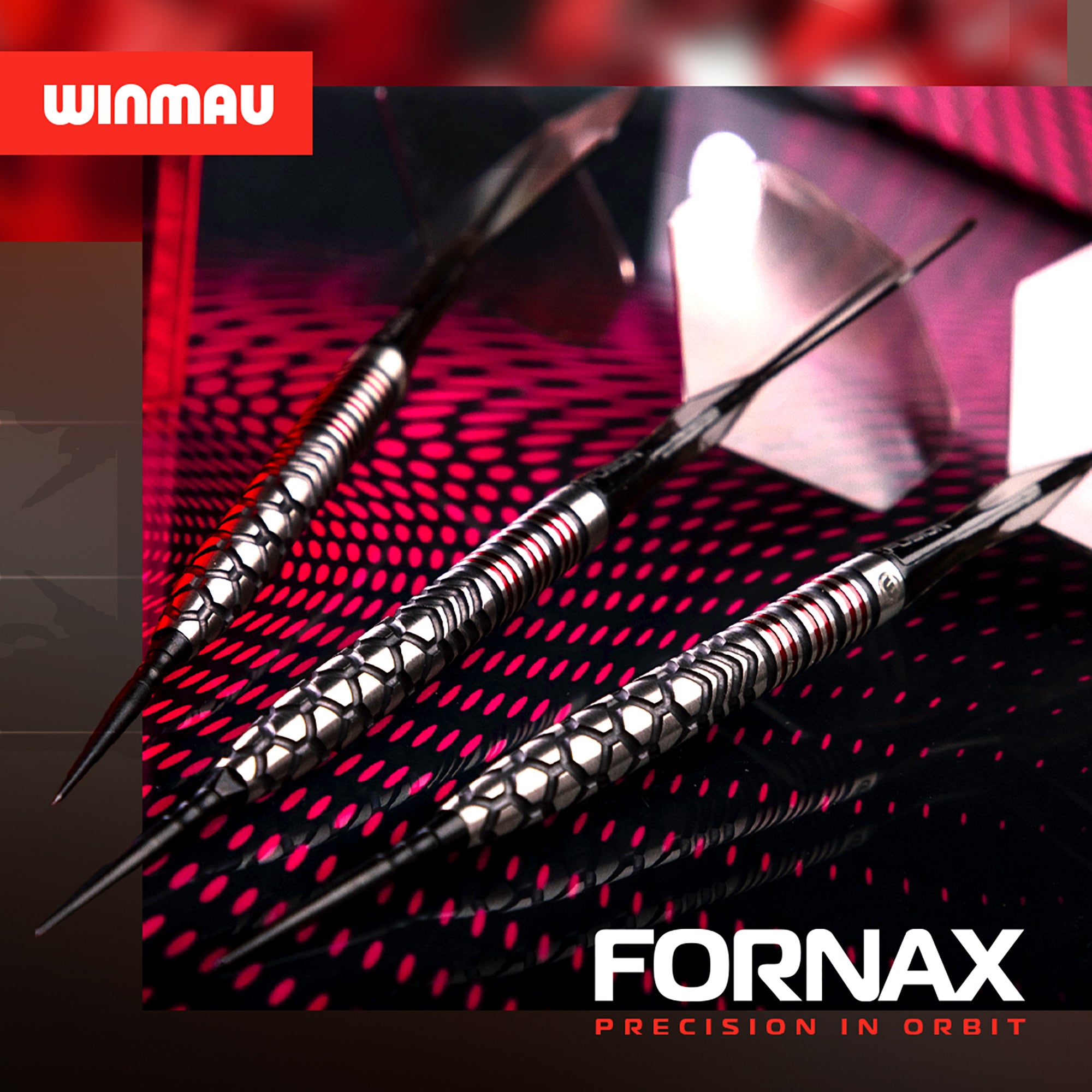 Three darts on a red and black patterned background with Winmau and Fornax branding.