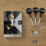 Dart set with packaging on a wooden surface