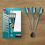 Three darts with a packaging box on a wooden surface