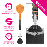 An orange and black dart with flight, shown alongside marketing callouts and a close-up of the swiss point tip mechanism. The image includes pink text and icons describing patented locking system, swiss point switching in seconds, and included swiss point tool, on a white background.