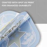 A close-up of a light blue printed dart flight. White text at the top reads 'CRAFTED WITH SPOT UV PRINT FOR ENHANCED DURABILITY.