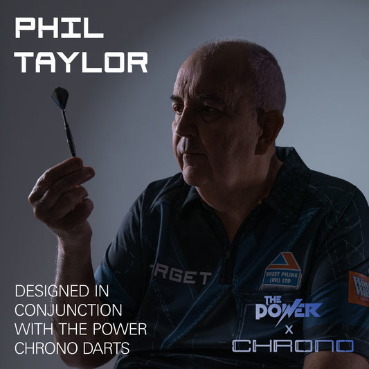 A promotional graphic for a Target darts shirt worn by Phil Taylor, who is holding a dart. The image features text overlays reading 'PHIL TAYLOR' and 'DESIGNED IN CONJUNCTION WITH THE POWER CHRONO DARTS' along with 'THE POWER x CHRONO' branding.