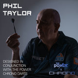 A promotional graphic for a Target darts shirt worn by Phil Taylor, who is holding a dart. The image features text overlays reading 'PHIL TAYLOR' and 'DESIGNED IN CONJUNCTION WITH THE POWER CHRONO DARTS' along with 'THE POWER x CHRONO' branding.