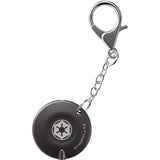 Second side of the swiss tool shown as keychain with a silver clasp on a white background