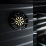Dartboard with a black frame on a dark background