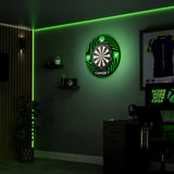 XBOX Surround and TOR Dartboard Bundle with green LED lighting on a wall in a dark room.
