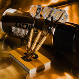 Bolide Envy 90% Tungsten Darts three darts on a yellow stand with a can of Gold Dust Wax in the background.