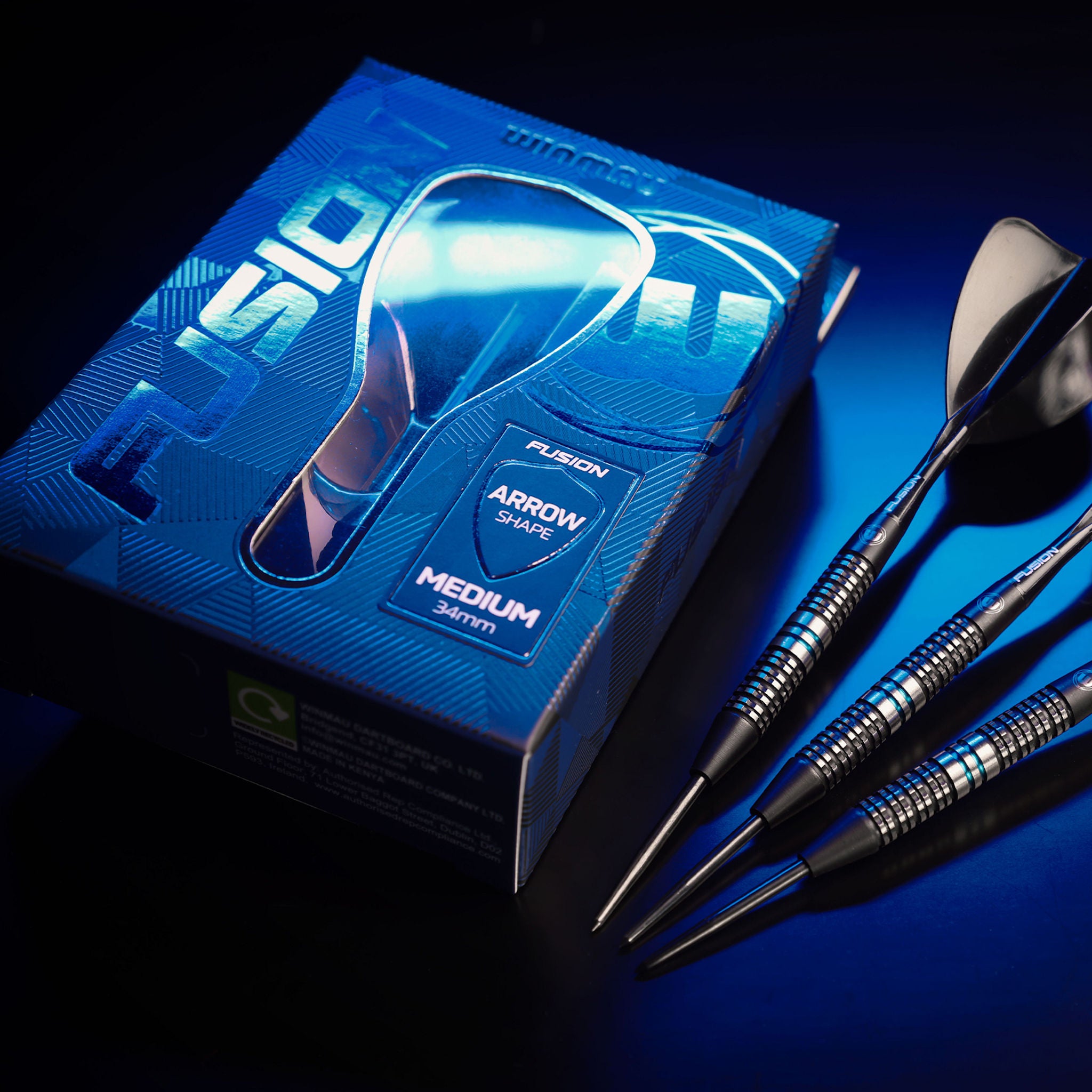 Blue dart packaging with darts on a dark background