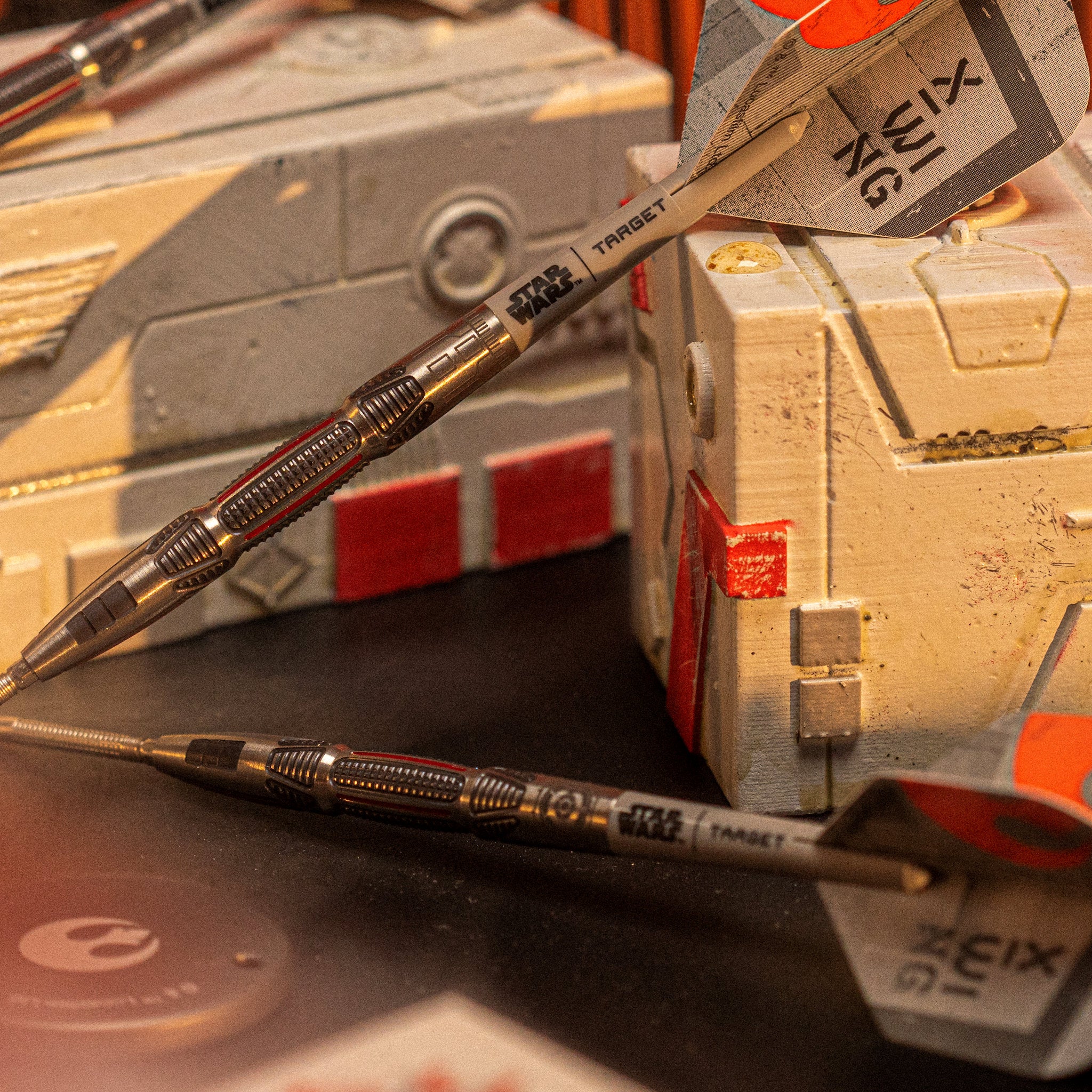 STAR WARS™ X-Wing 90% SP Darts two darts with 'X-Wing' labels on a Target 3d block background